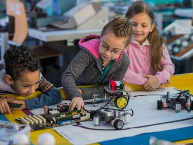 Students building a robotics kit