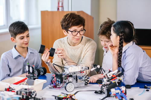 Student coding and programming a robot